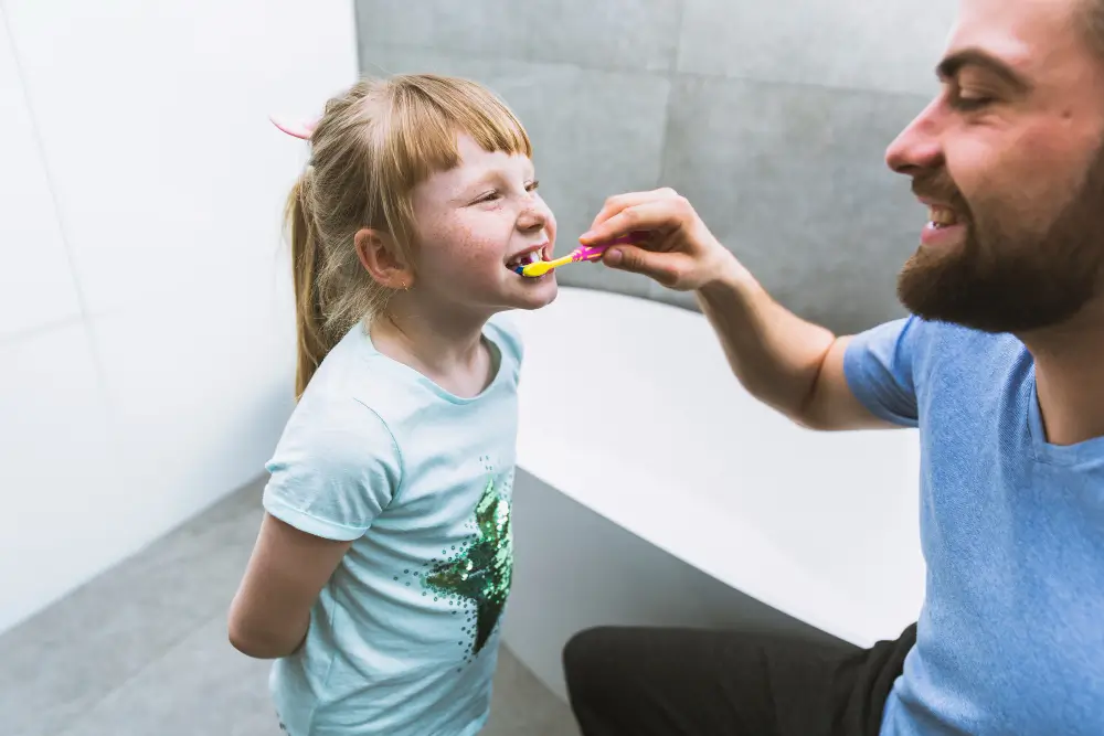 Parent and child smiling together after a positive dental visit at ZPD Dental Clinic in Zionsville