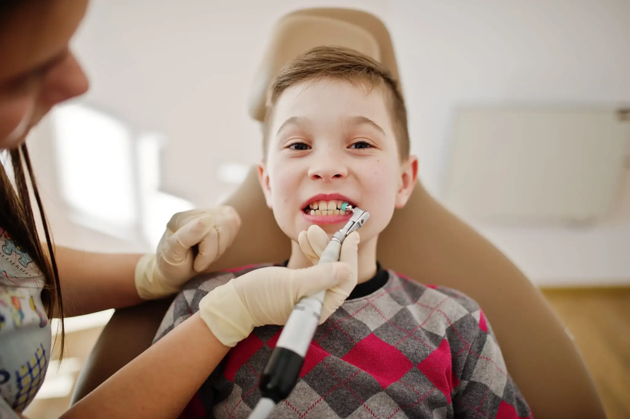 Little boy sitting in the dentist chair during a gentle check-up at ZPD Dental Clinic