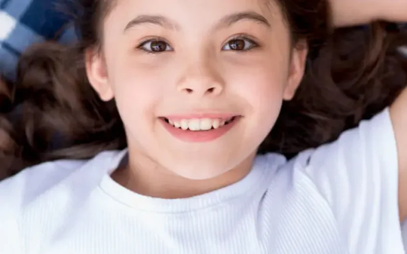 close-up-cute-attractive-girl-lying-blanket