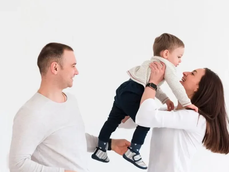 mother-father-with-child-copy-space_23-2148463651