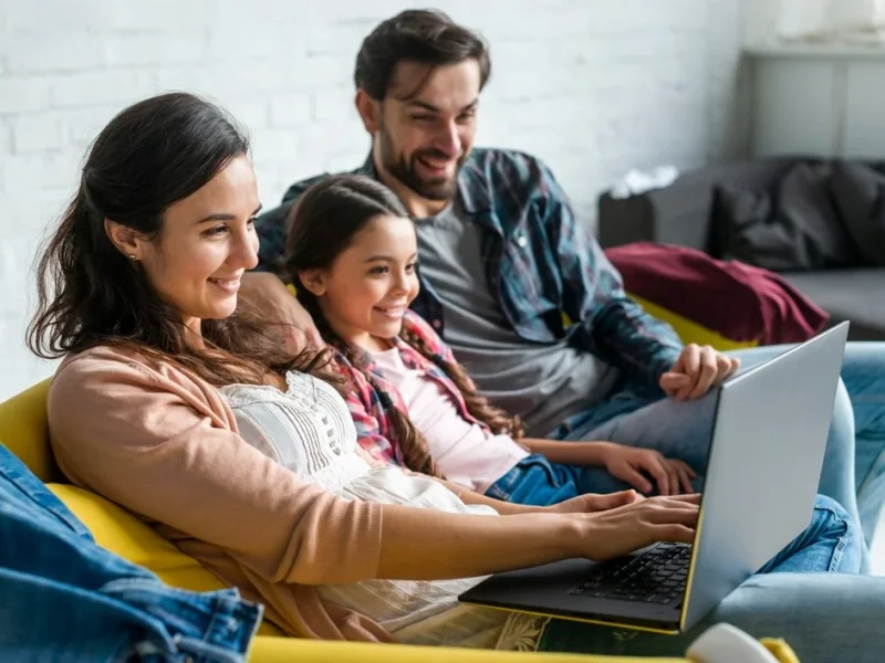 parents-daughter-using-laptop_23-2148456294